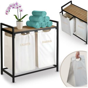 A kétkamrás szennyestartó kosár kerettel, 80L, fehér | Massido praktikus megoldást kínál a szennyes szétválogatására az otthonban, modern dizájnban.